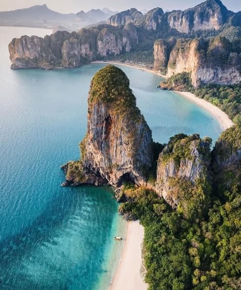 a large rock formation on a beach
